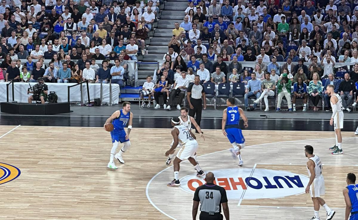 Dallas Mavericks’ Luka Doncic and Grant Williams setting up a play against Real Madrid in a preseason exhibition match.
